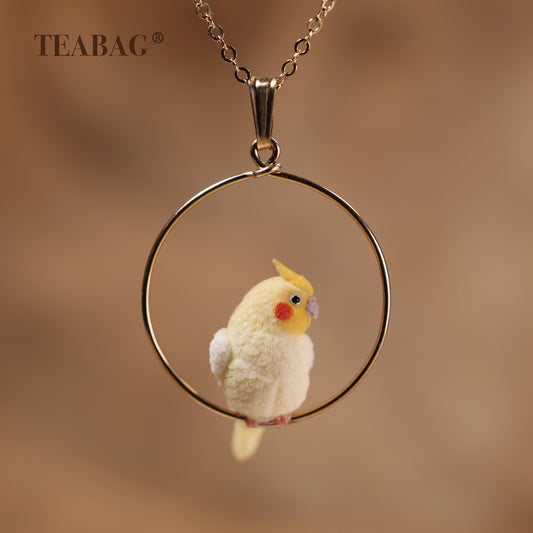 Cockatiel necklace pendant with the full bail, gold-tone hoop and bird visible.